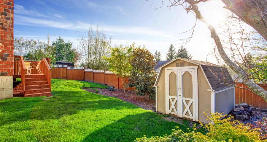 Fenced backyard with storage shed in Hagerstown